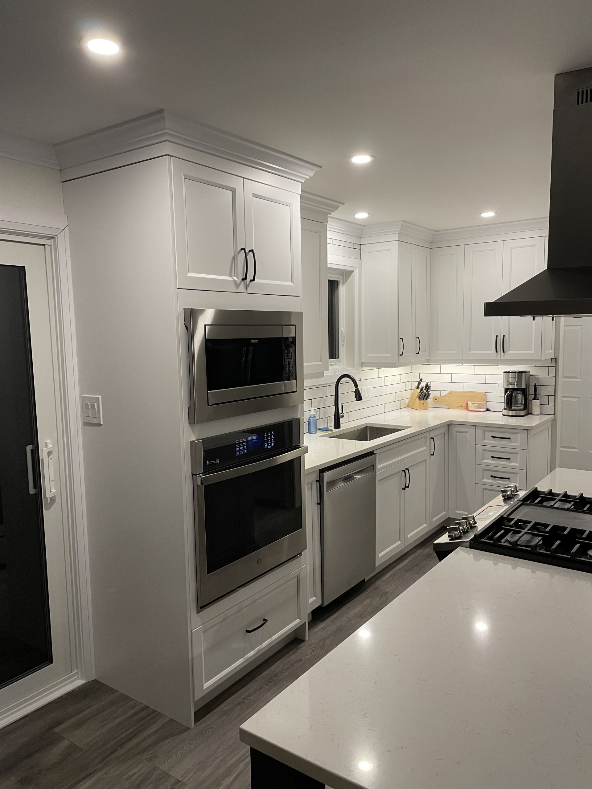 Wall oven and prep area after full kitchen renovation with custom cabinetry by SSP Cabinetry