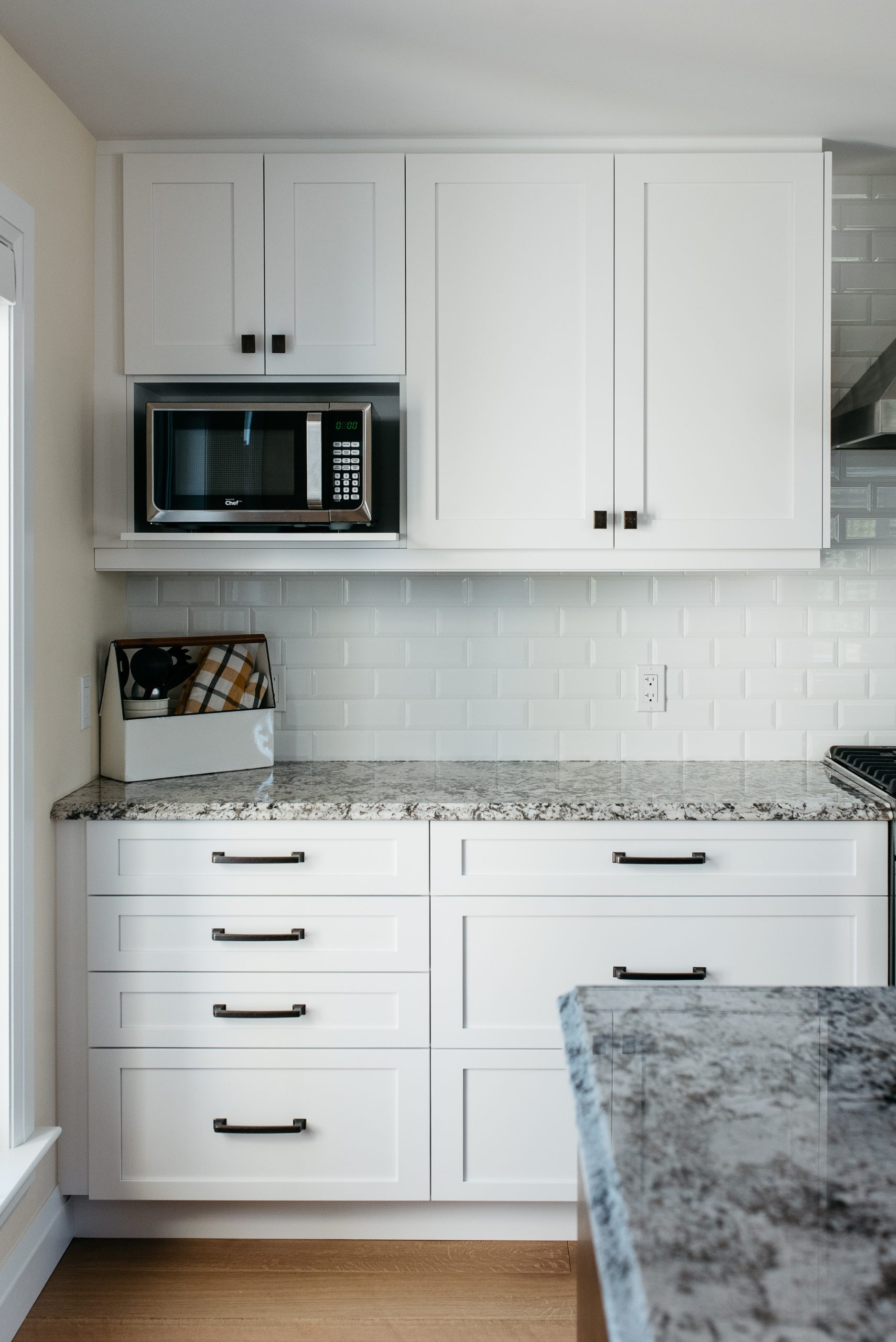 A gorgeous kitchen remodel featuring custom cabinetry and island by SSP Cabinetry and Millwork